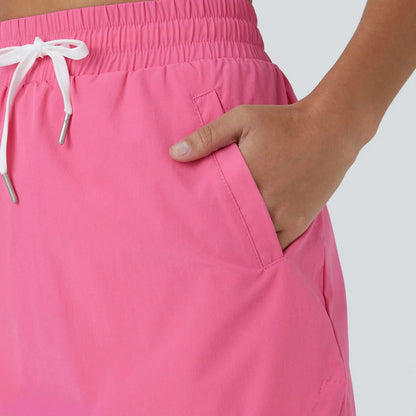GOLFGLIDE GONNA - Gonna da golf leggera 2-in-1 con shorts integrati e cordino