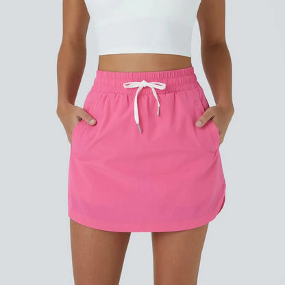 GOLFGLIDE GONNA - Gonna da golf leggera 2-in-1 con shorts integrati e cordino