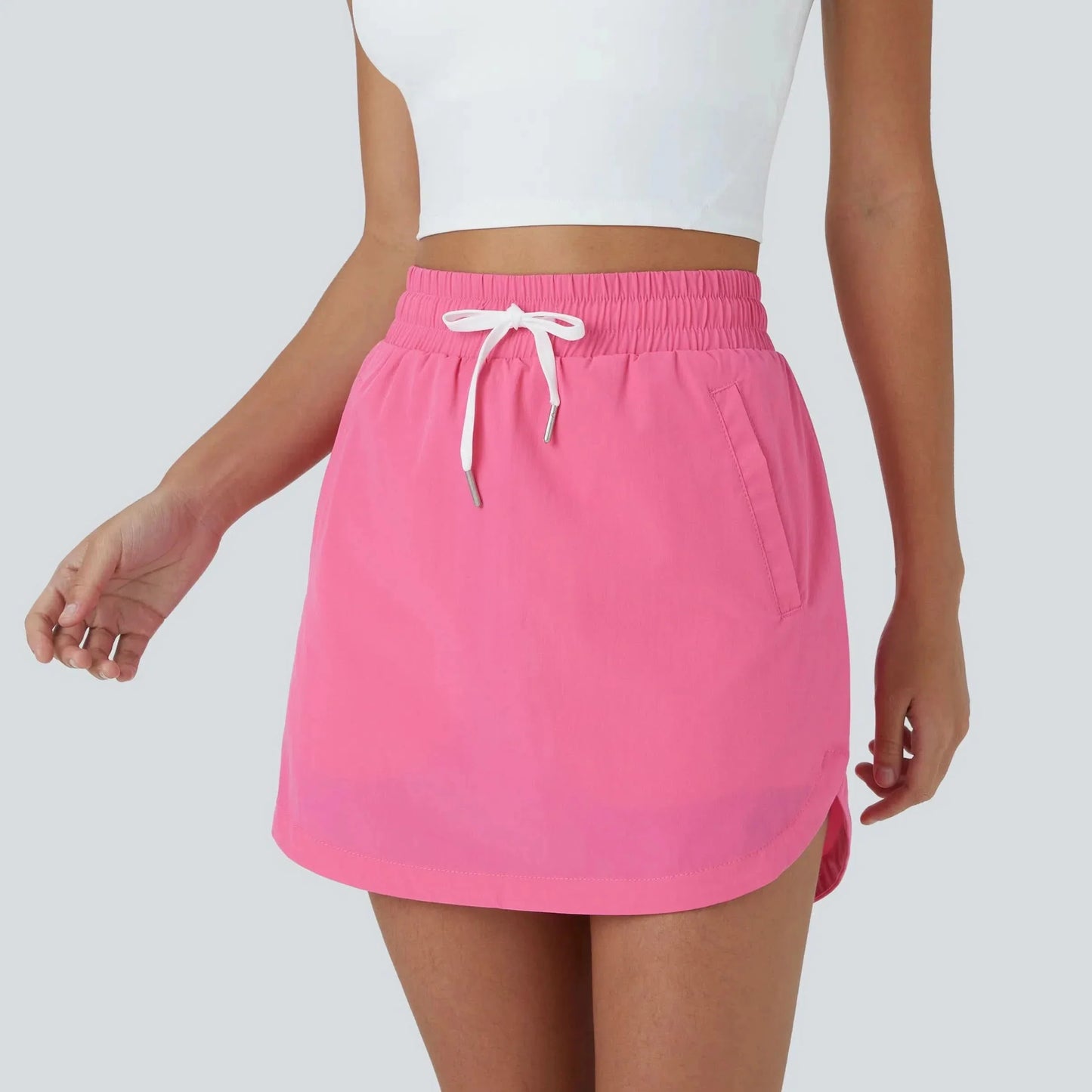 GOLFGLIDE GONNA - Gonna da golf leggera 2-in-1 con shorts integrati e cordino