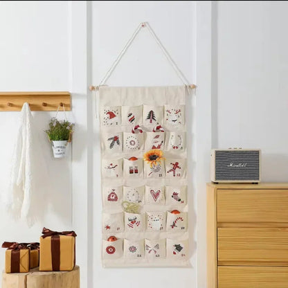 FestiveCanvas | Calendario dell'Avvento colorato da appendere con 24 tasche portaoggetti