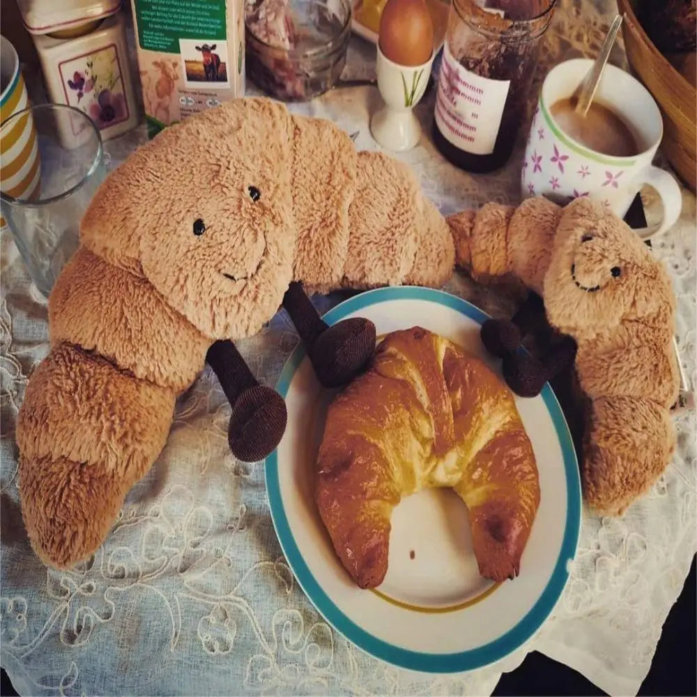 Cuscino Peluche a Forma di Croissant 33 cm – Morbido, Marrone Chiaro, con Sorriso