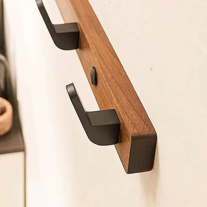 Gancio appendiabiti da parete con design in legno e metallo