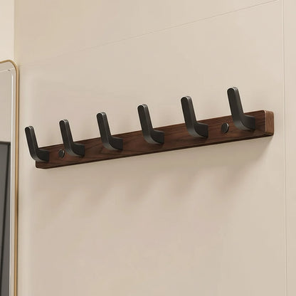 Gancio appendiabiti da parete con design in legno e metallo