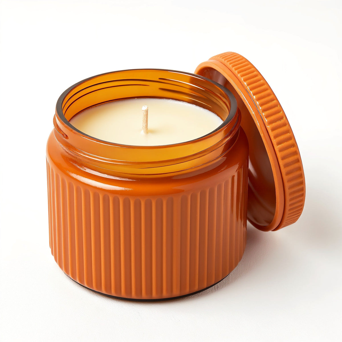 Candela di soia Ginger Spice — Vaso arancione con texture a coste