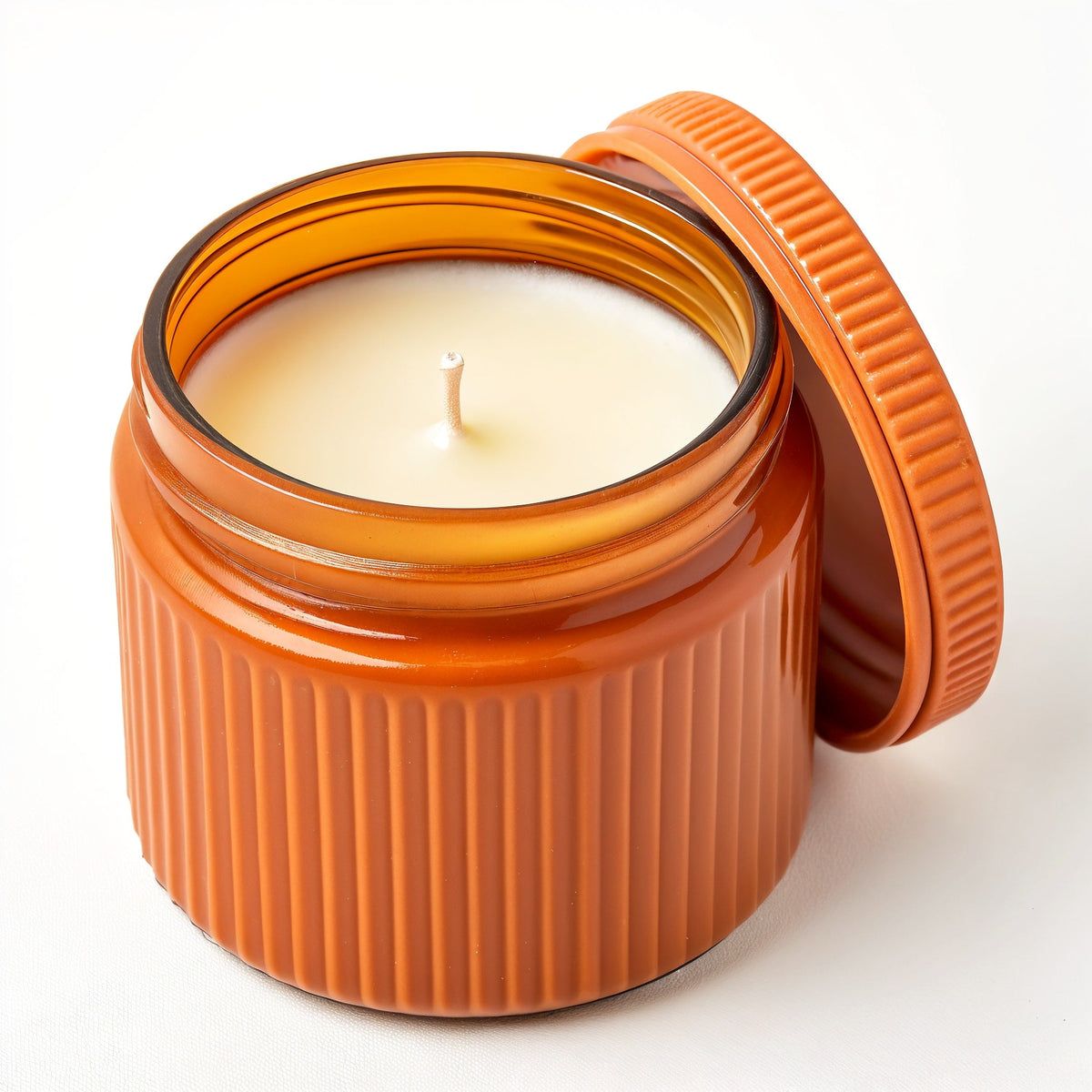 Candela di soia Ginger Spice — Vaso arancione con texture a coste