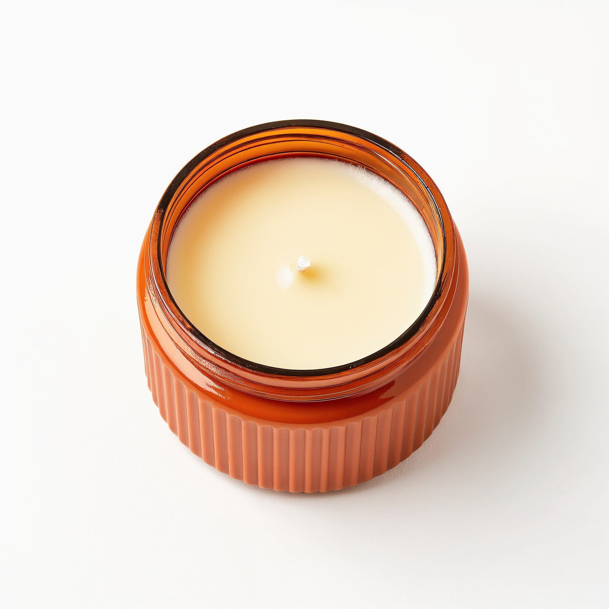 Candela di soia Ginger Spice — Vaso arancione con texture a coste