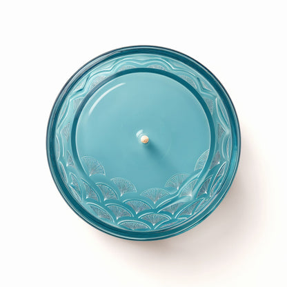 Candela di soia Ocean Mist in vasetto di vetro blu con motivo a onde